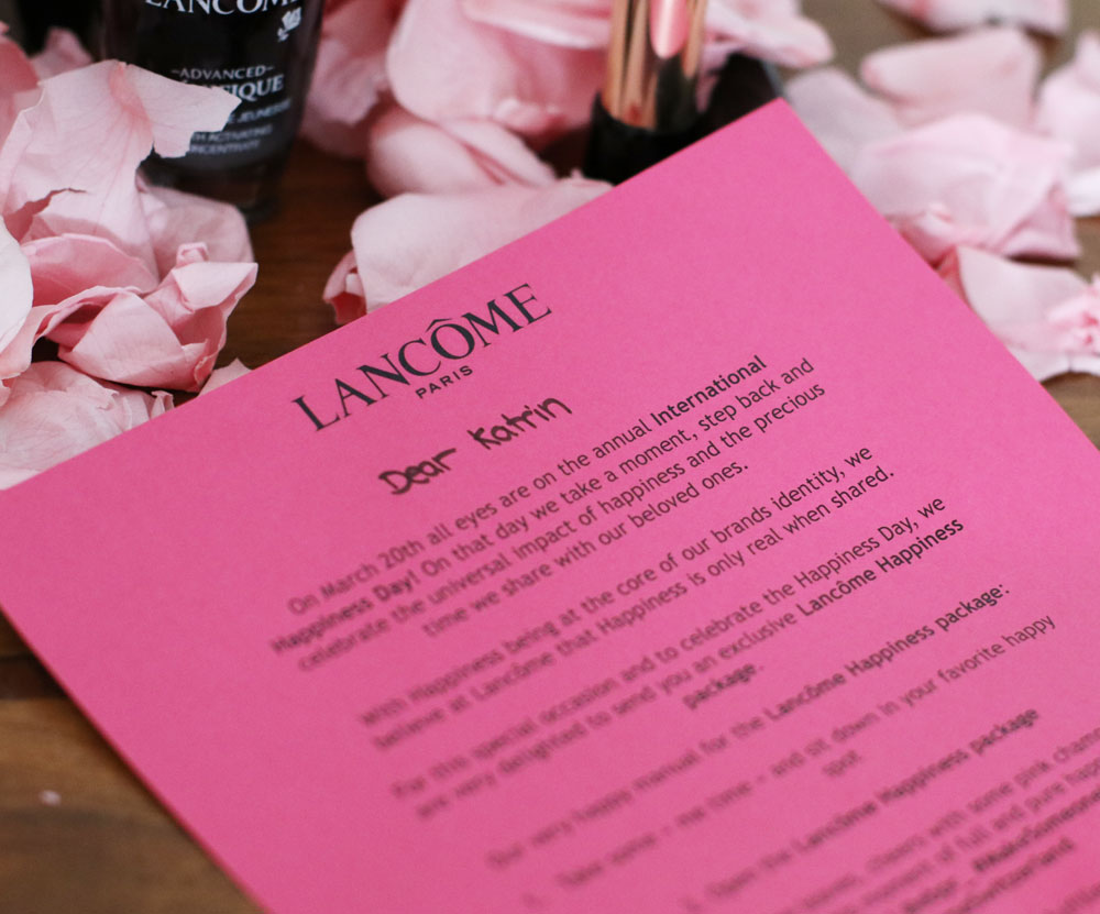 Lancome feiert den Weltglückstag in pink.